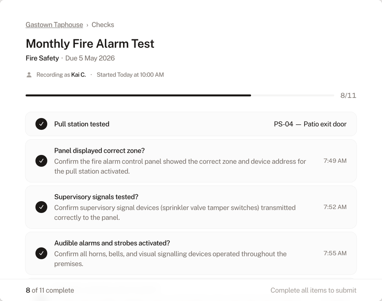 Check completion form showing a fire alarm test in progress
