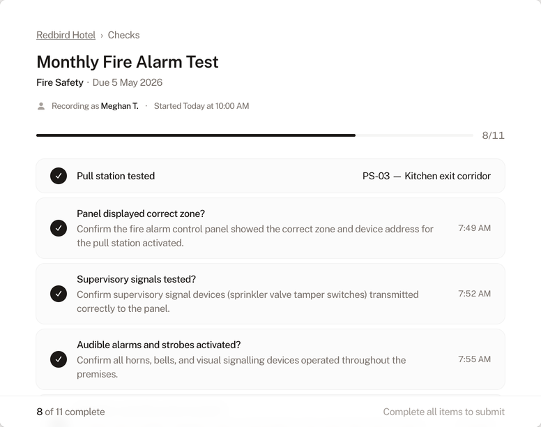 Check completion form showing a fire alarm test in progress