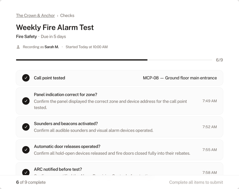 Check completion form showing a fire alarm test in progress